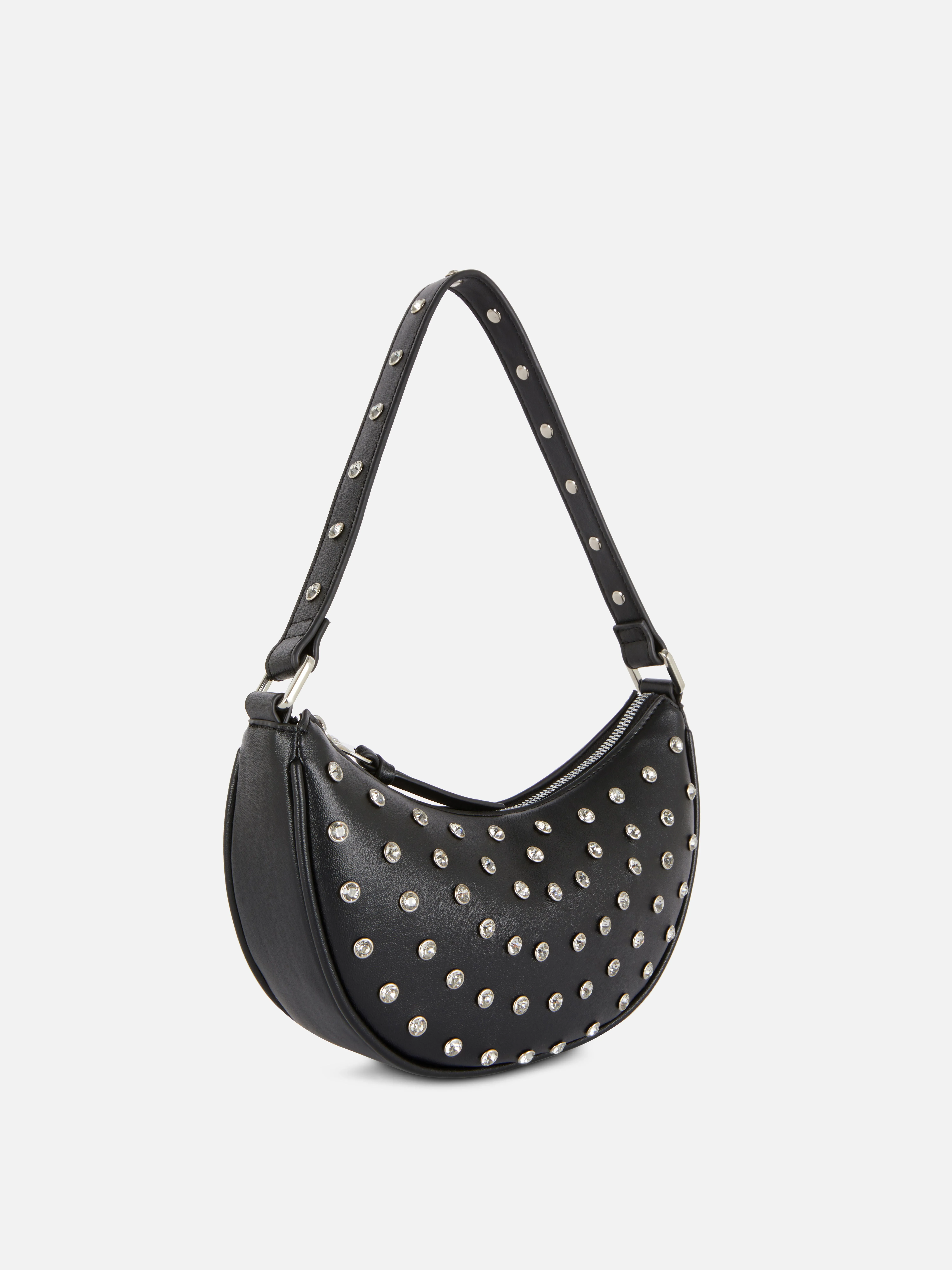 Bolso de mano con strass y tachuelas de Rita Ora