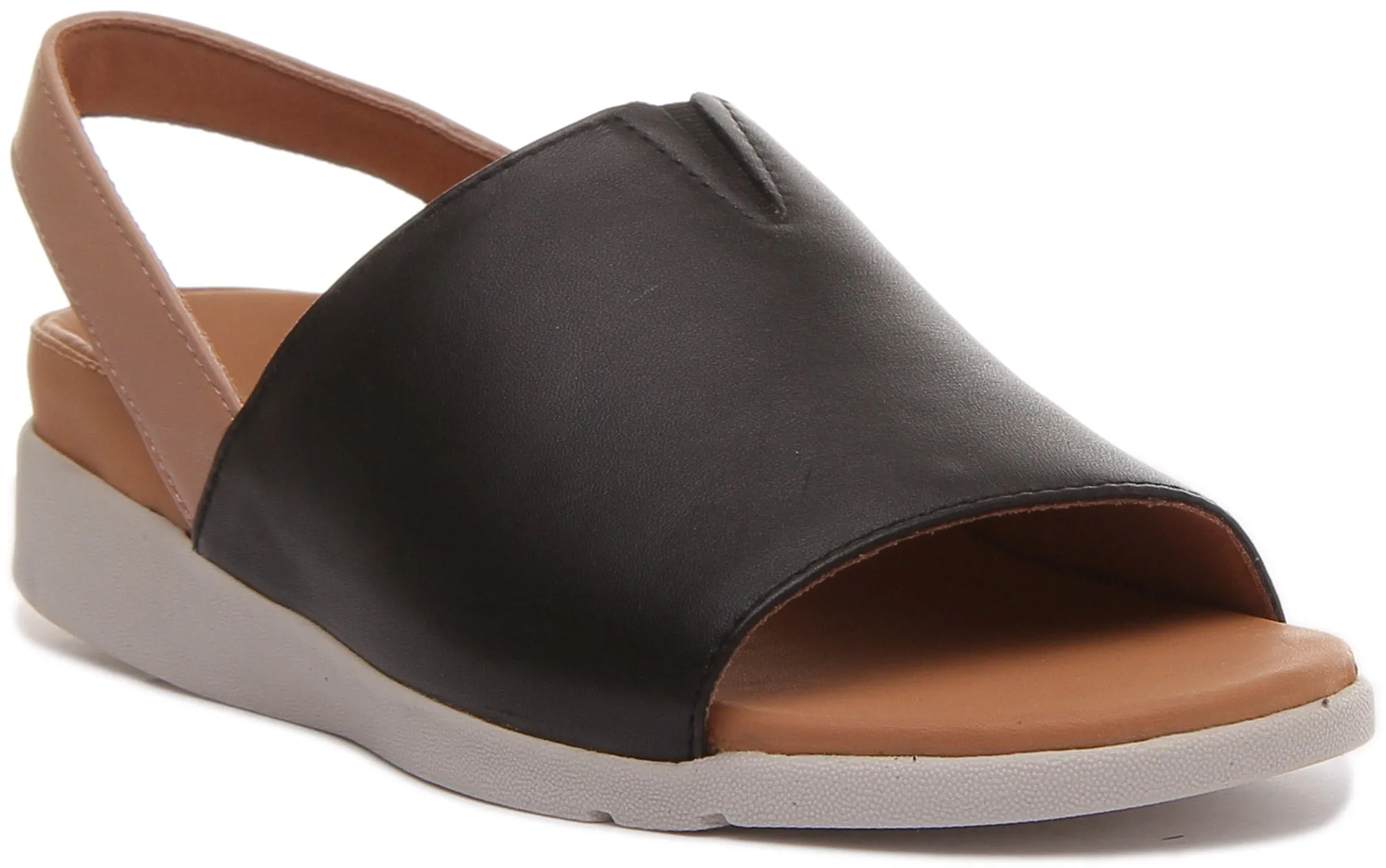 Strive Mara Sandalia con tira de cuero elevada para mujer en leopardo