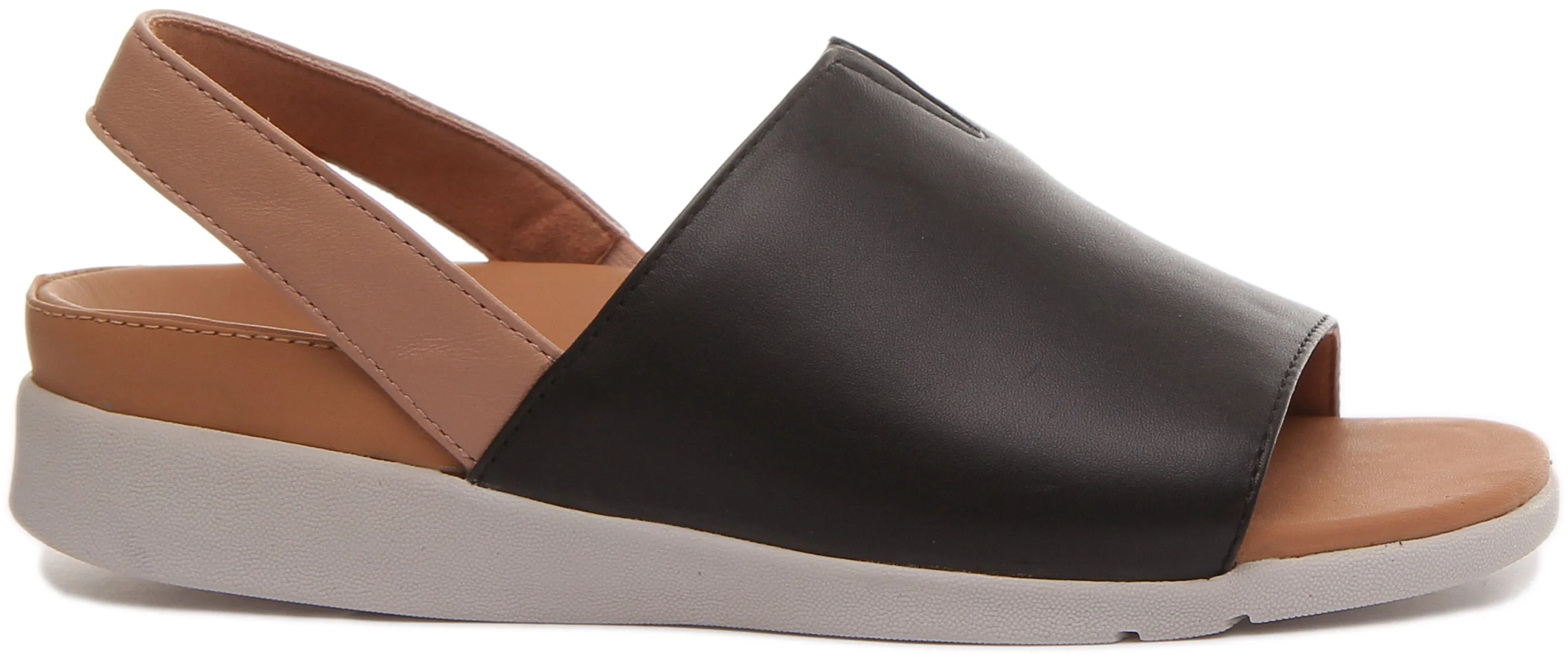 Strive Mara Sandalia con tira de cuero elevada para mujer en leopardo