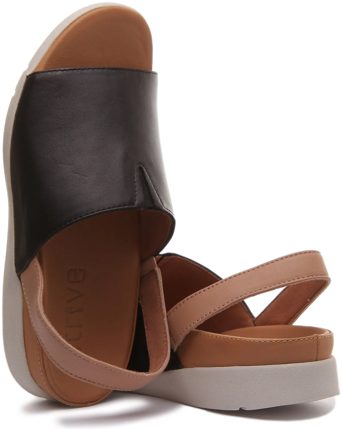 Strive Mara Sandalia con tira de cuero elevada para mujer en leopardo